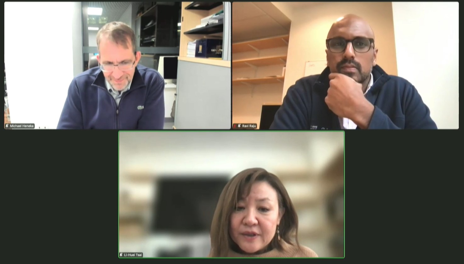 Three images are stacked in the frame. Across the top are head and shoulders pictures of Michael Heneka on the left and Ravi Raju on the right. They are listening as Li-Huei Tsai (on the bottom) speaks.