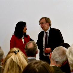 Li-Huei Tsai and Hans Wigzell talk at the front of a lecture room as an audience watches